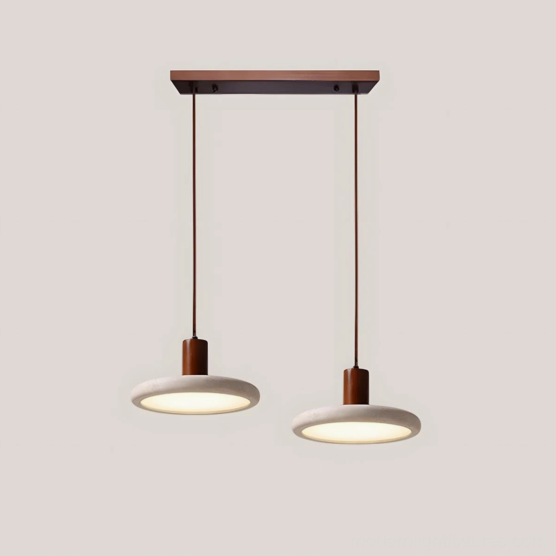 Twin Mesa Halo travertine pendant fixtures above kitchen island counter in minimalist Scandinavian interior design scheme