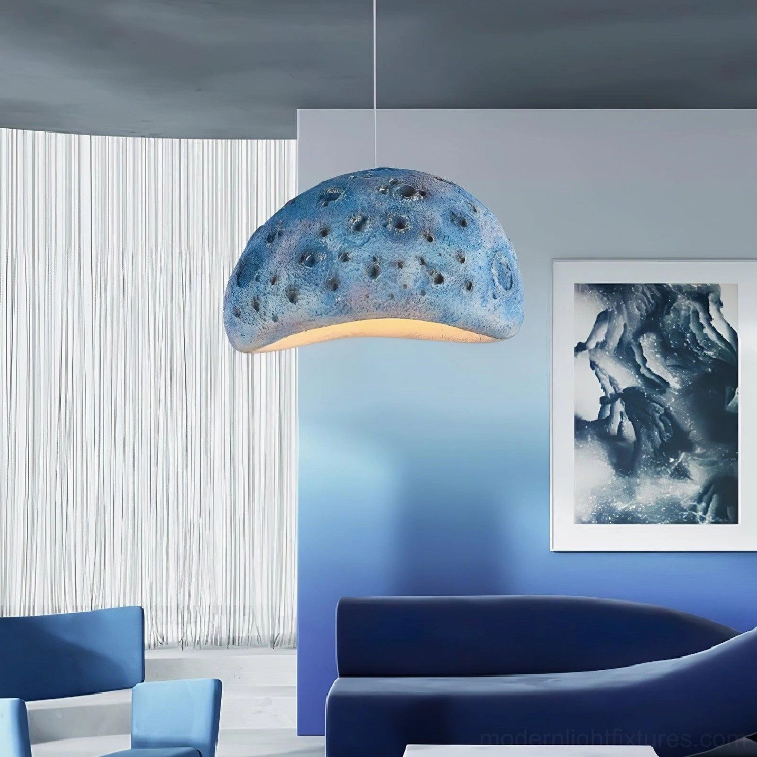Meteorite crater pendant light showing textured crater surface detail and construction quality