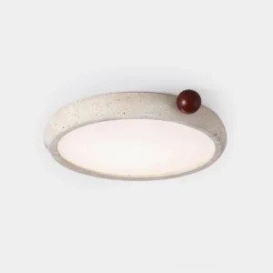 Metra travertine ceiling light overhead view showing circular stone frame with integrated walnut wood accent sphere