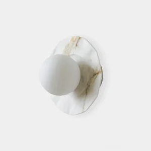 Meza marble wall sconce with irregular organic marble base and frosted glass globe, front view