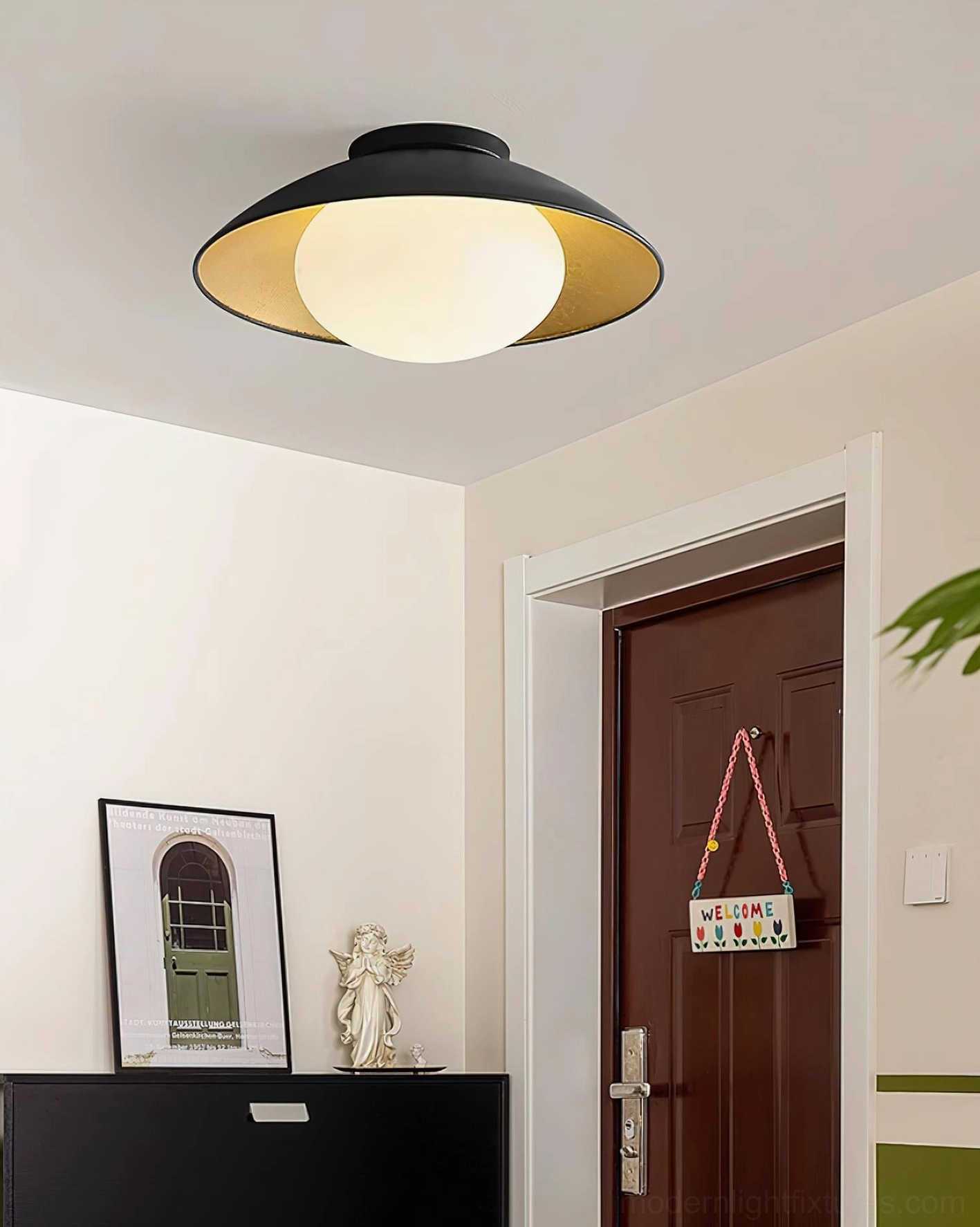 Mezo flush mount ceiling light installed above residential entry door contemporary home