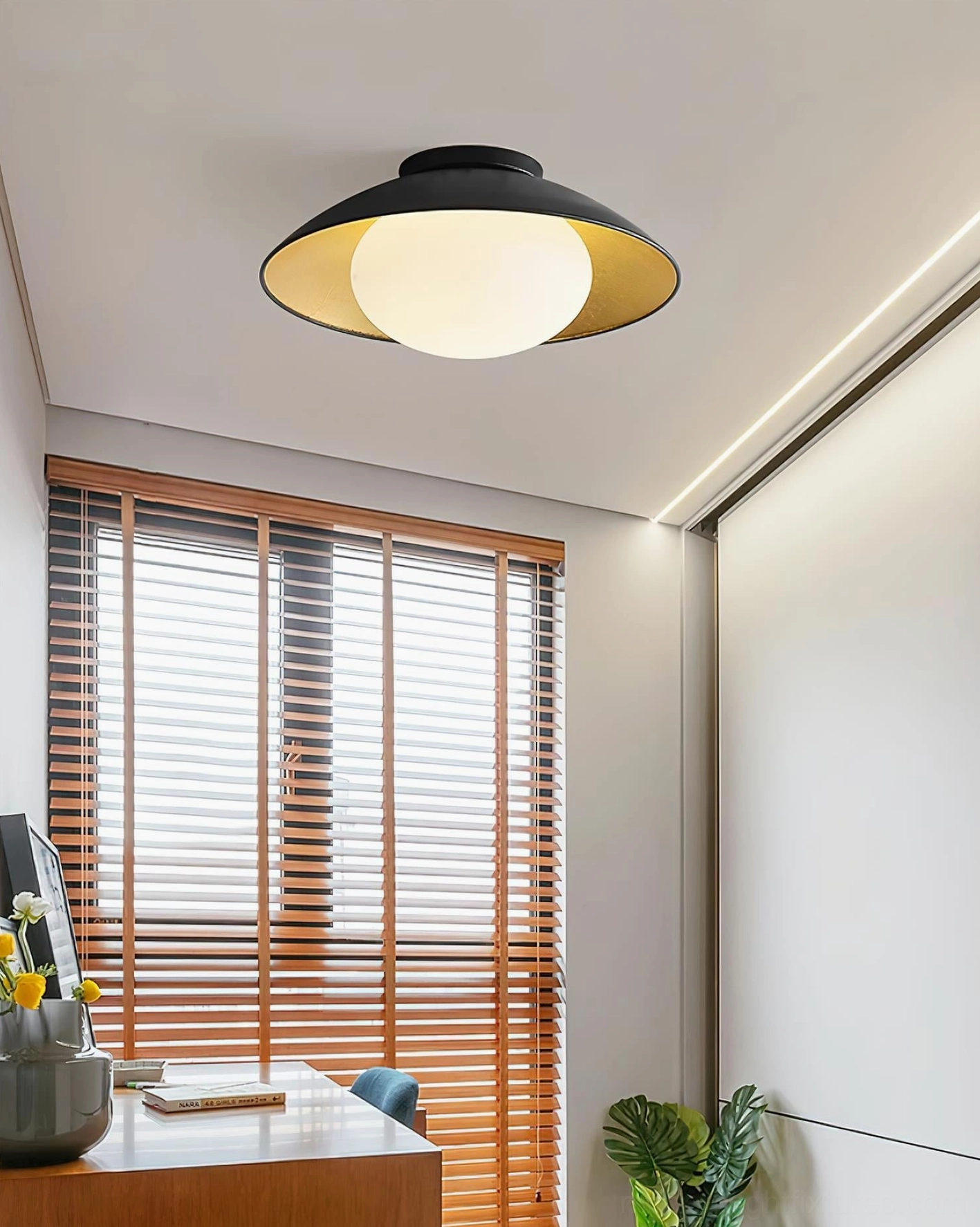 Contemporary Mezo ceiling light installed in home office space above study desk wooden blinds