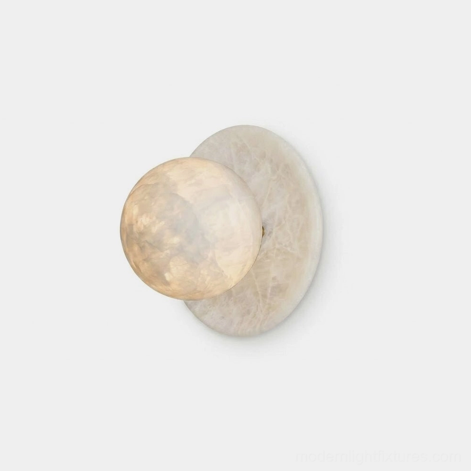Mia Ball Alabaster Wall Sconce — natural carved stone disc and sphere with warm cream and grey veining, front studio view