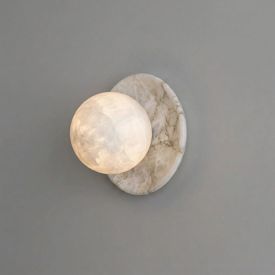 Mia Ball Alabaster Wall Sconce — natural stone sculpture with crystalline veining detail, studio flat lay