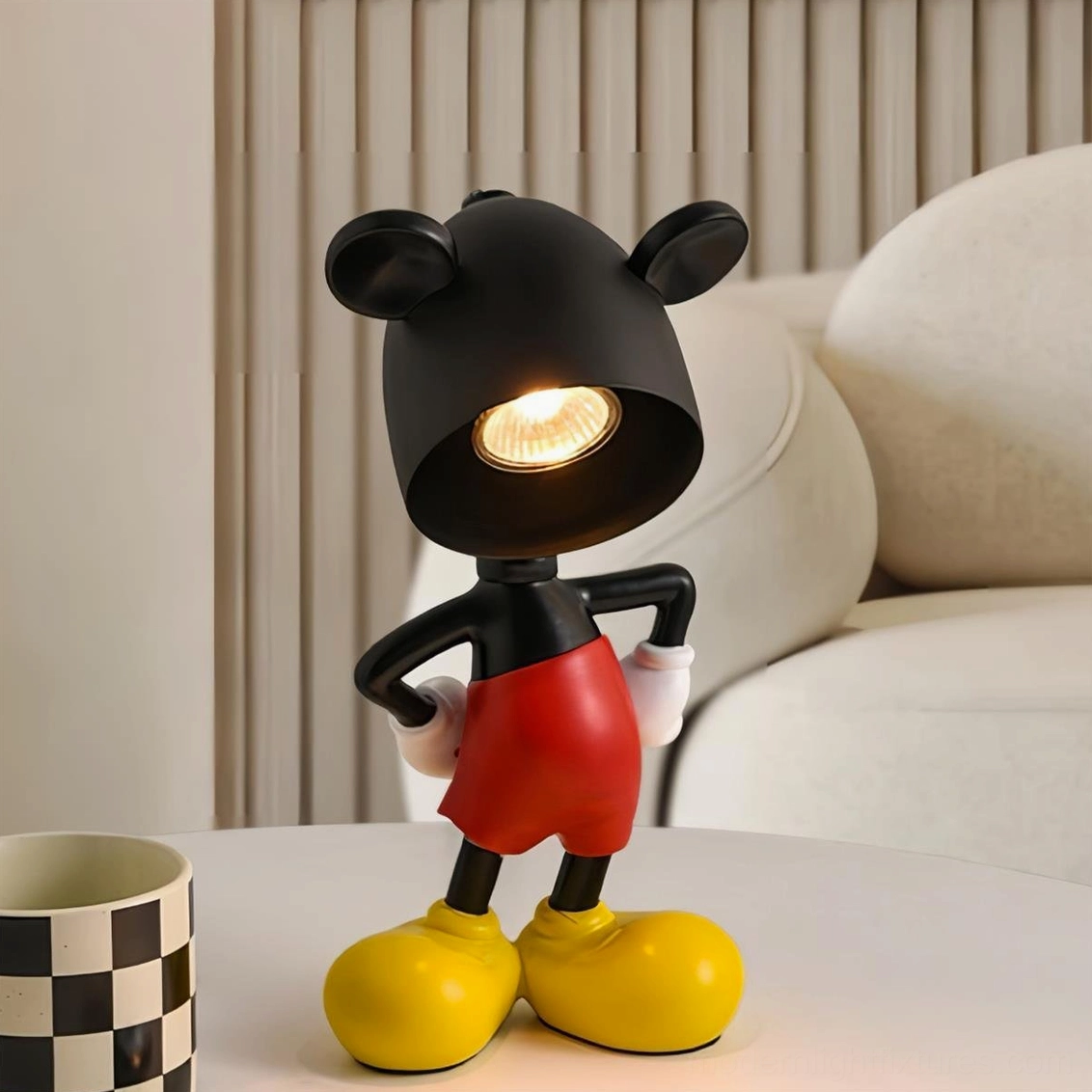 Mickey candle warmer desk lamp on living room side table with checkered mug