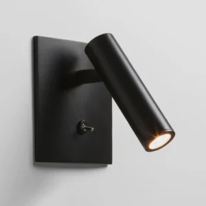 Compact wall sconce with integrated toggle switch, side close-up detail showing square backplate and LED beam output in warm white light