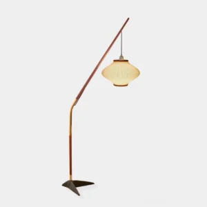 Mid-century arc floor lamp with walnut wood pole, brass accents, and black triangular metal base, front studio view