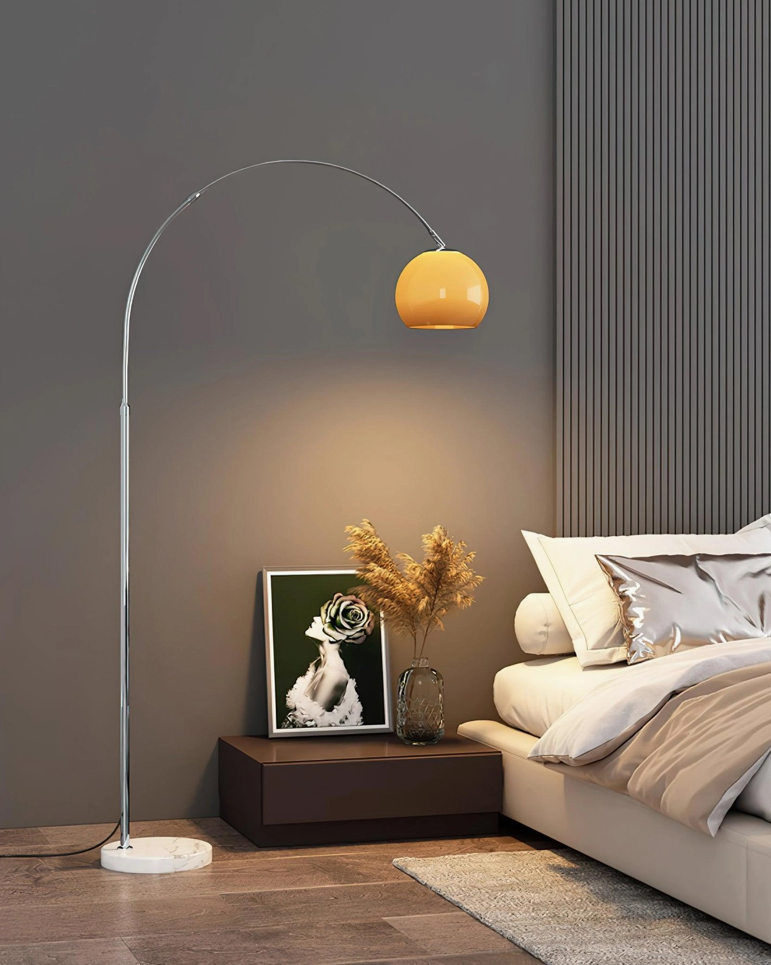 Mid-century modern arc floor lamp in bedroom, side view with warm ambient lighting