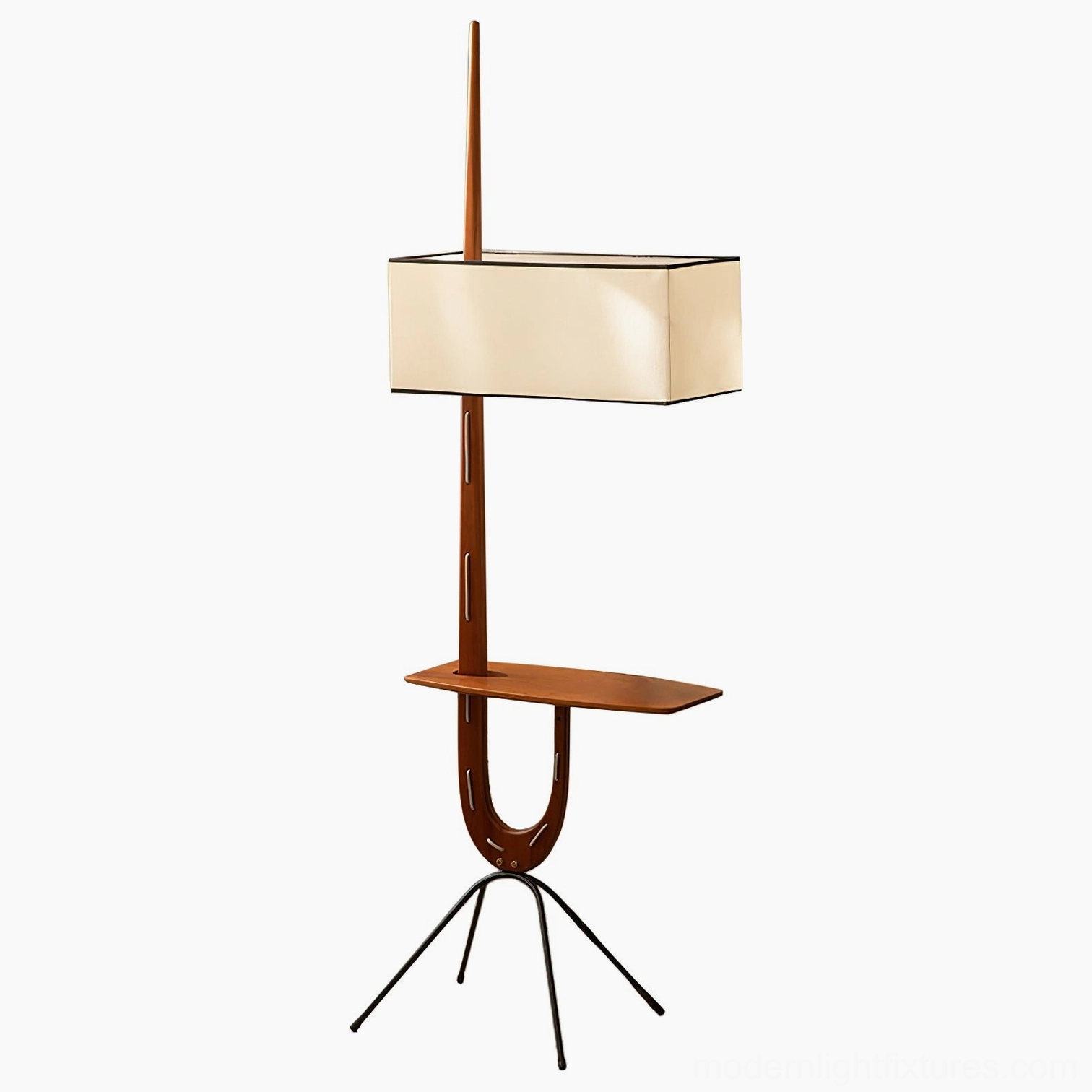 Mid-century modern floor lamp with side shelf and green sofa in stylish home setting