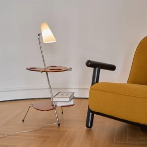 Minimalist floor lamp with dual-tiered wooden shelves paired with mustard yellow accent chair in contemporary living room
