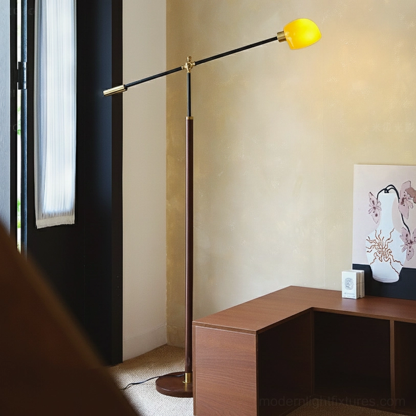 Heritage swing arm floor lamp with yellow shade in modern home office workspace side view