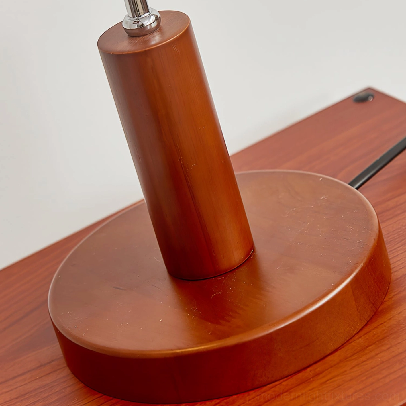 Adjustable modern table lamp with mid-century industrial design, chrome arm and layered wood construction