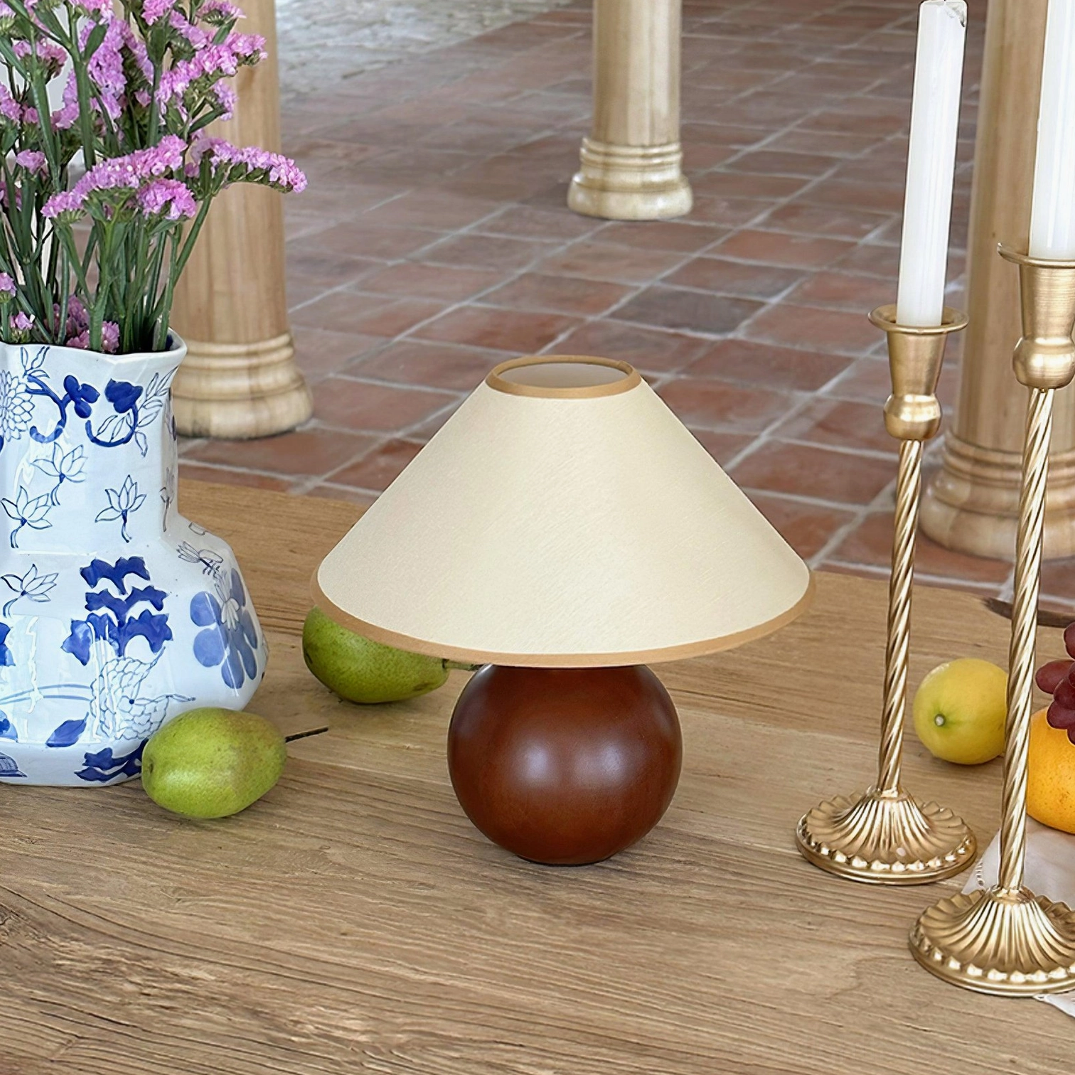 Mid-century modern table lamp with hemp shade in stylized home setting and design composition