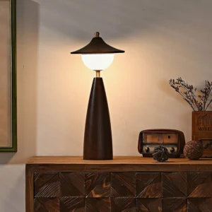 Vintage mid-century table lamp displayed on retro wooden sideboard with carved cabinet and radio decor