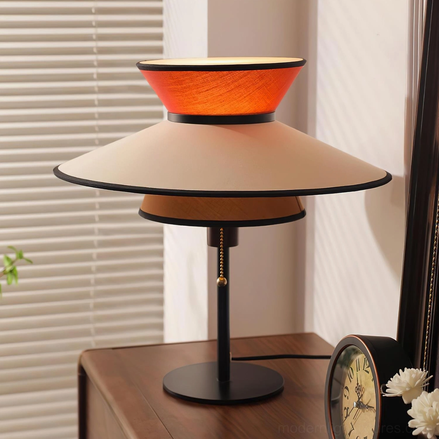 Mid-century modern conical table lamp with layered fabric shade design showcasing contemporary lighting fixture artistry and geometric form