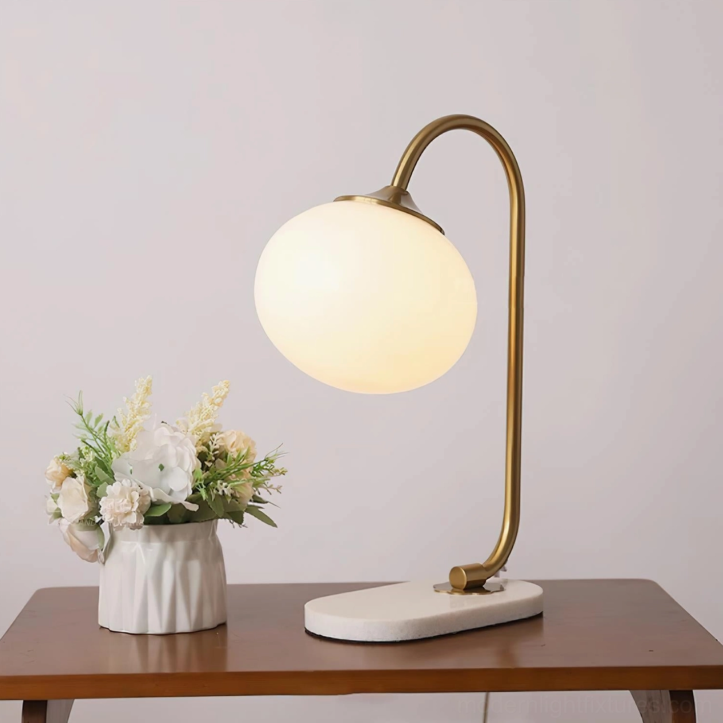 Mid-century modern globe table lamp with gold metal frame and white marble base styling