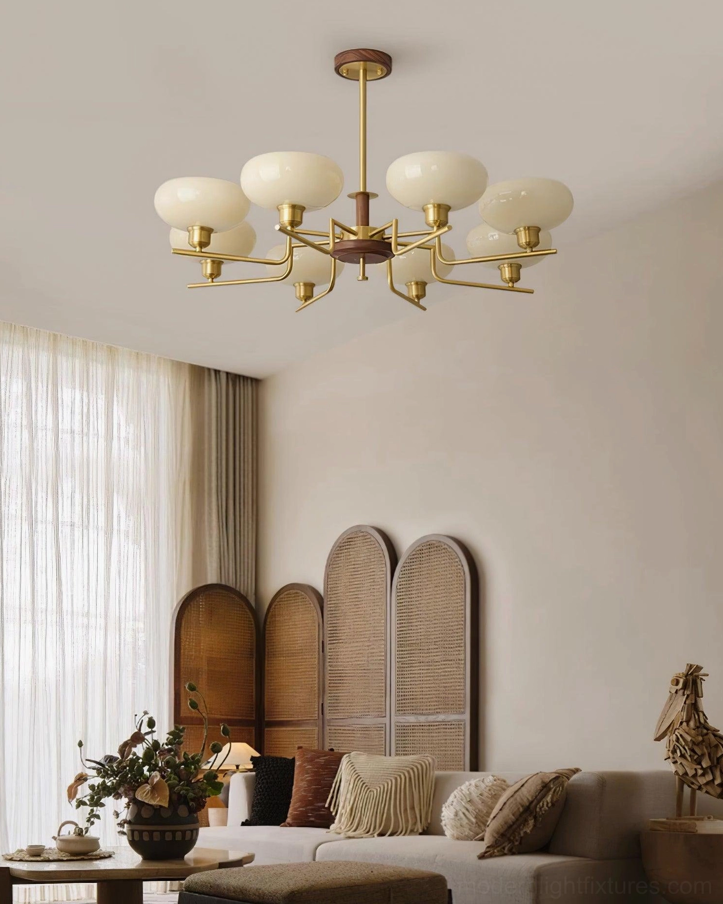 Mid-century modern multi-head glass pendant light fixture in cozy warm-toned residential interior with neutral furnishings