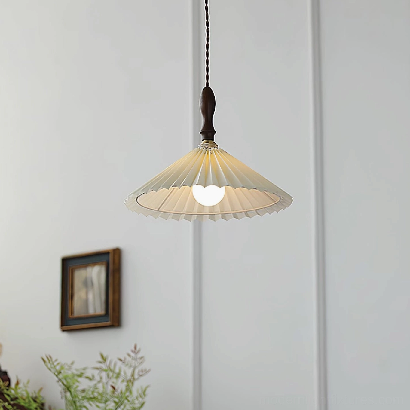 Mid-century modern pleated pendant light creating sculptural accent in minimalist living room