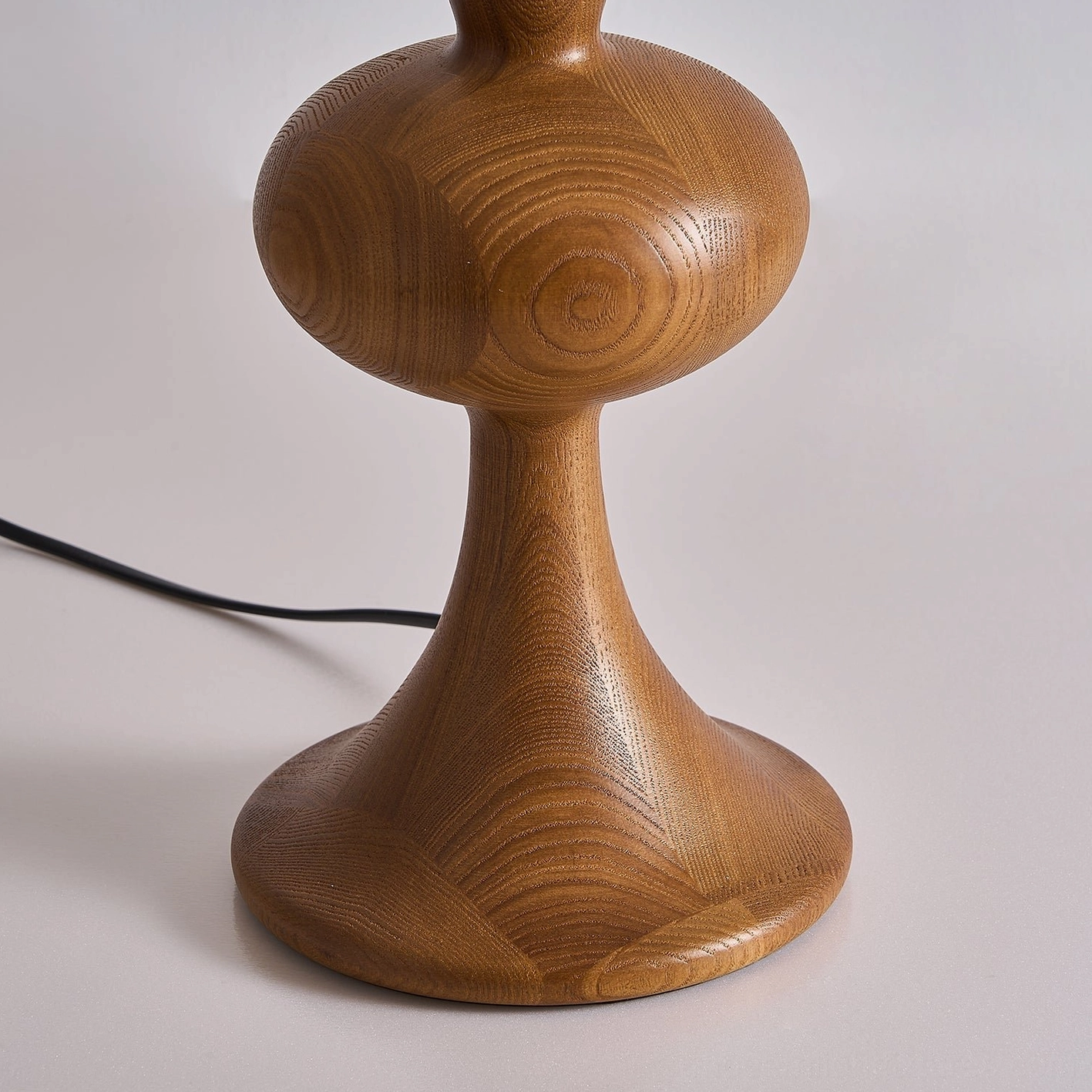 Mensy mid-century modern table lamp featuring natural wood base and marble-veined alabaster shade for contemporary interior spaces