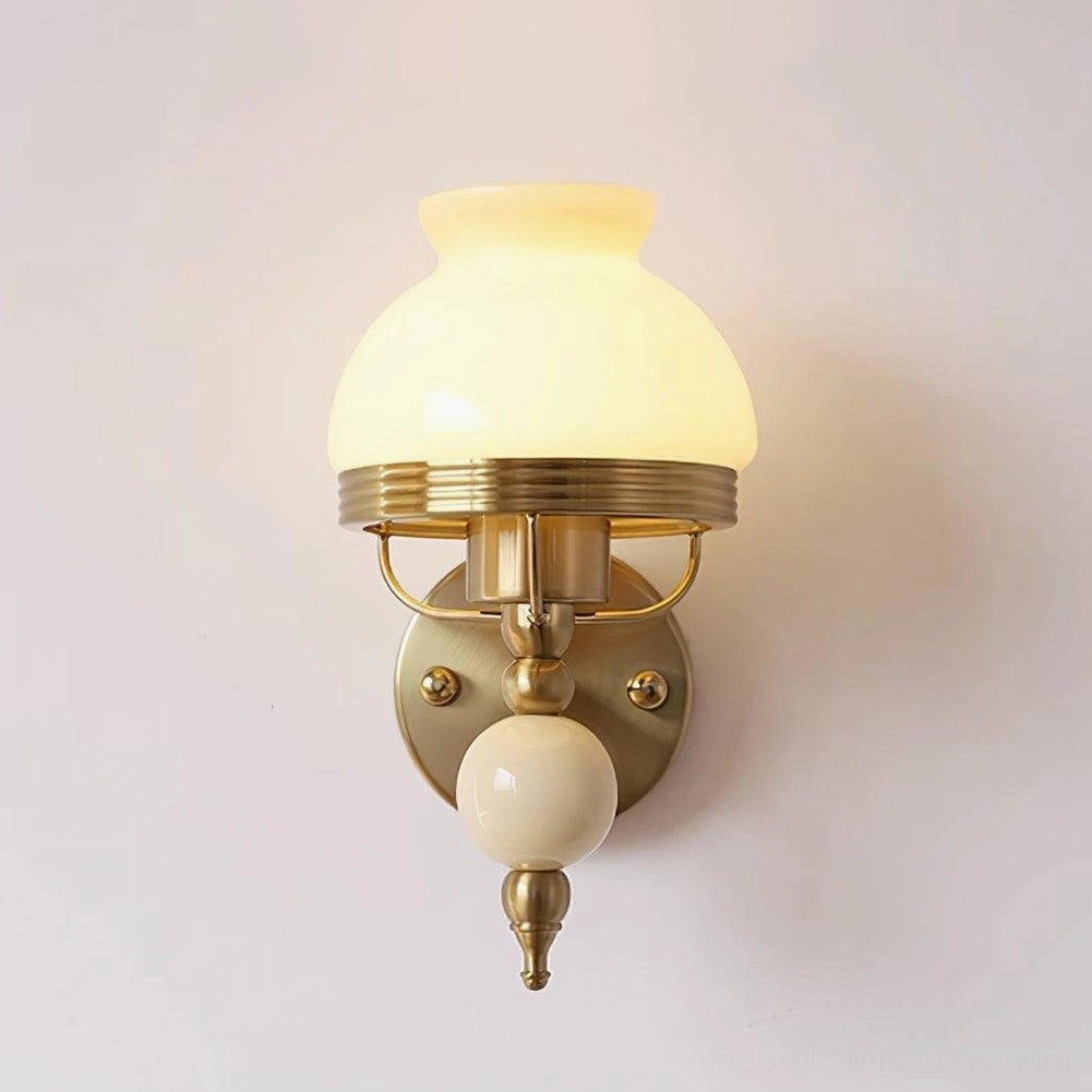Mid-century modern style wall sconce with frosted glass shade, perfect for retro interior design