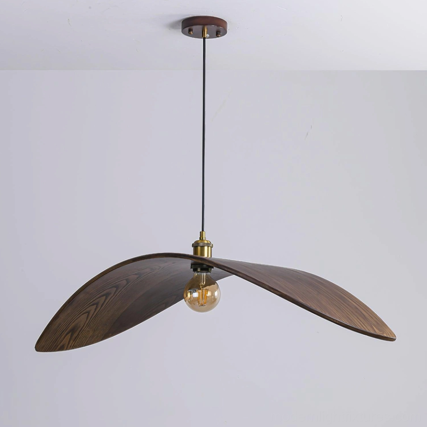 Walnut wood leaf pendant lamp showcasing mid-century modern design with exposed vintage bulb aesthetic