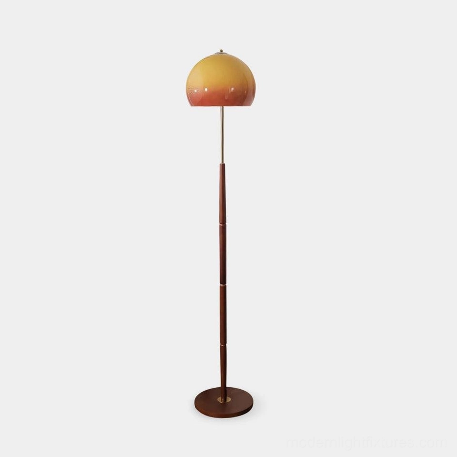 Mid-century mushroom floor lamp with caramel gradient glass shade and dark walnut wood pole, front studio view