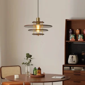 Pendant light hanging above round wooden dining table in mid-century modern dining nook