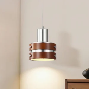 Mid-century modern wood metal pendant light illuminated with warm downlight, three-quarter angle