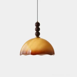 Front view of mid-century rippled glass pendant light with walnut sphere, amber glass shade hanging against white studio background