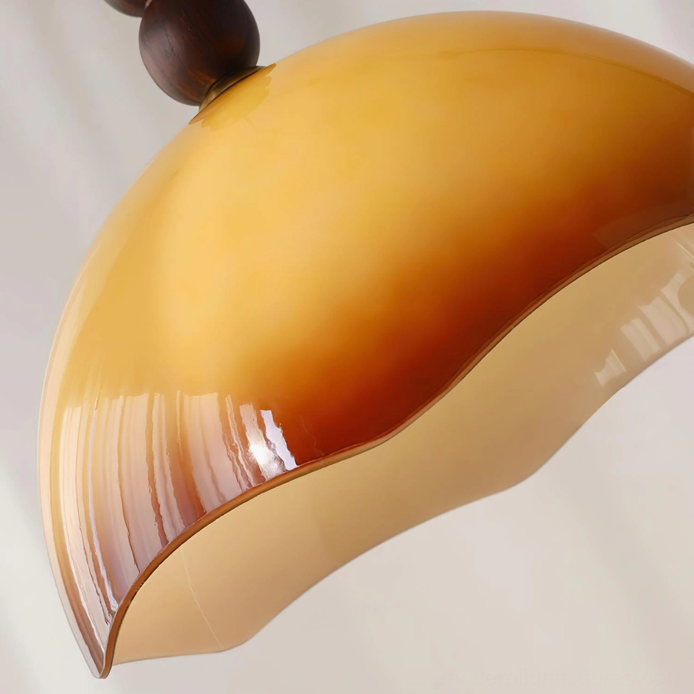 Mid-century rippled glass pendant light with sustainable walnut wood sphere in eclectic bohemian interior