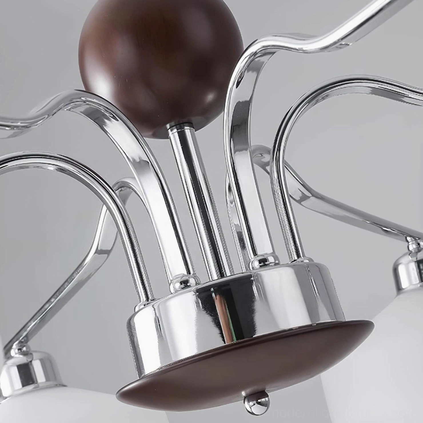 Mid-century sputnik chandelier detail shot showing chrome-plated metal and walnut wood accents