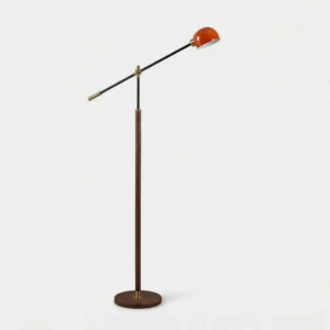 Heritage mid-century swing arm floor lamp with black and red color combo, frontal studio view showing brass accents and round metal base