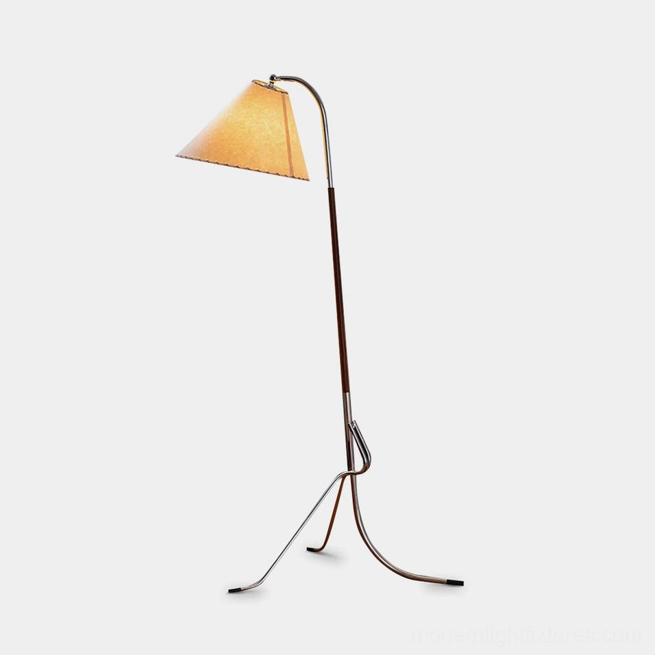 Mid-century tripod floor lamp front three-quarter view on white studio background, showing chrome metal stand and walnut wood pole with adjustable arm