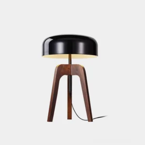 Mid-century modern wood tripod table lamp with black shade, front studio view showing walnut wooden legs and contemporary cylindrical shade design