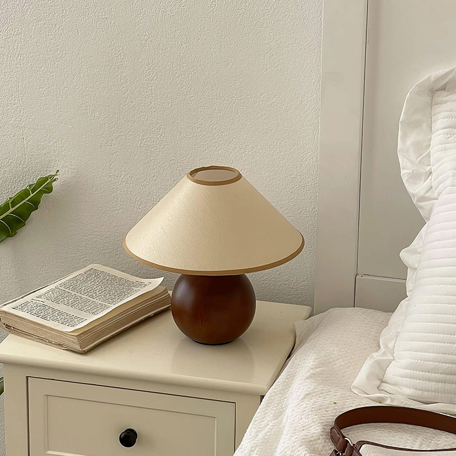 Mid-century style wooden table lamp with natural grain patterns and fabric shade detail