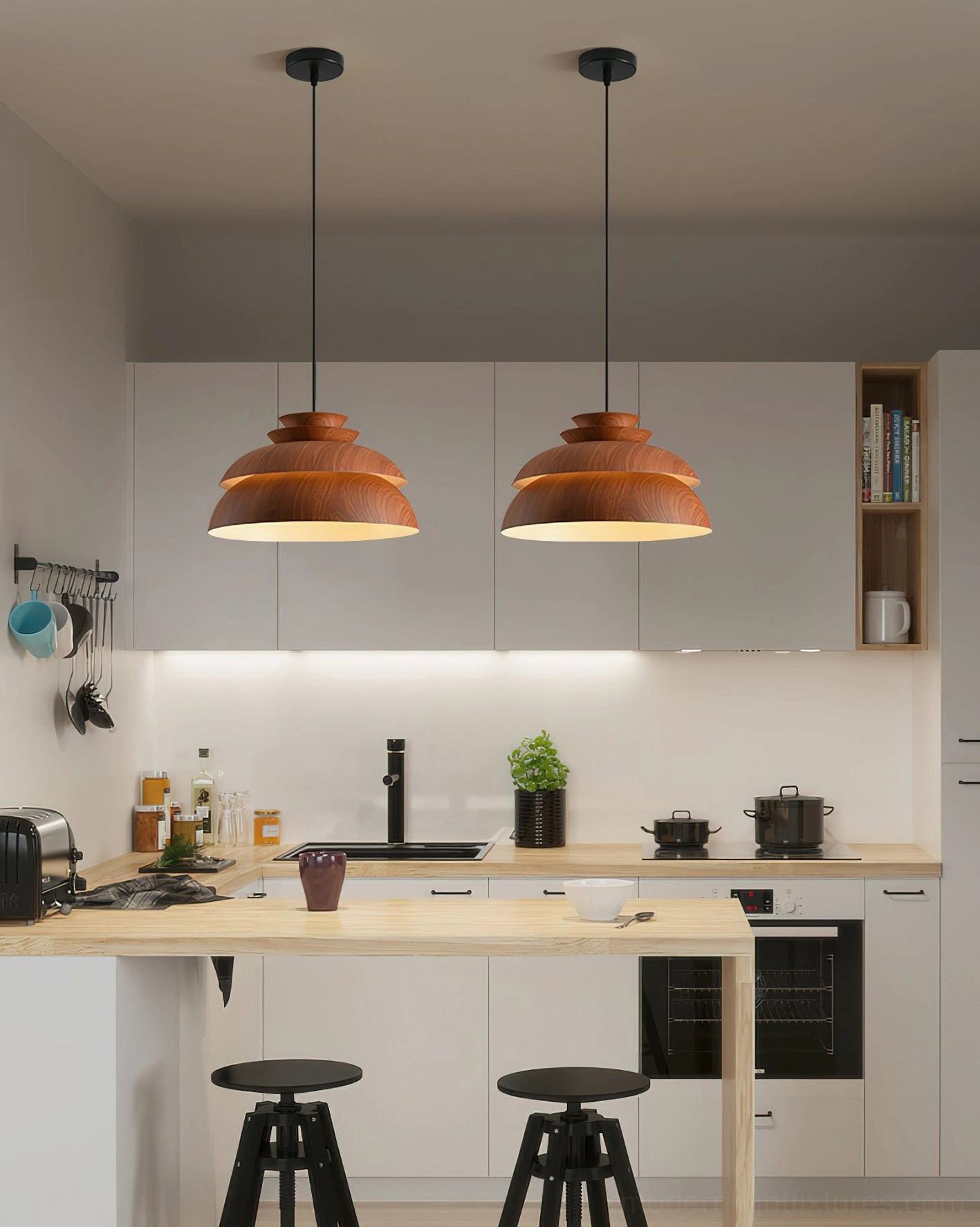 Two Midori modern pendant lights with black suspension cords above kitchen island, contemporary home setting