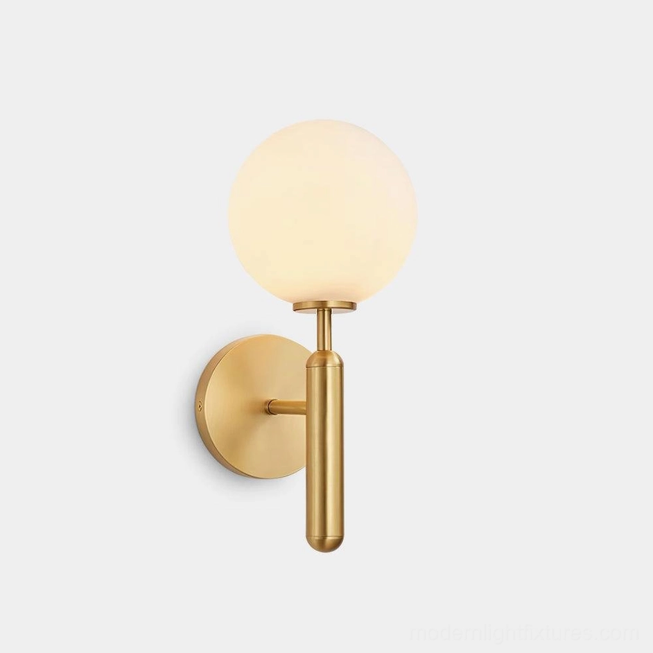 Miira brass globe wall sconce with frosted glass shade, direct front view on white background