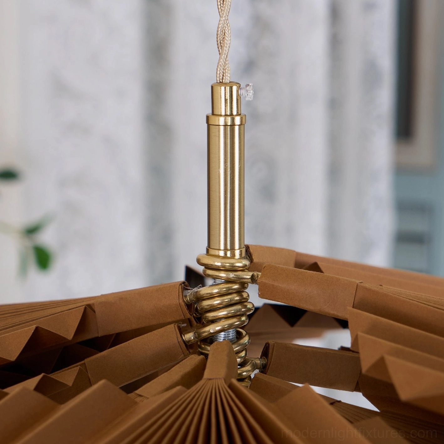 Mikado pleated pendant light in Scandinavian bedroom interior with natural materials and warm tones
