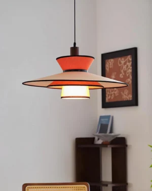 Milano pendant light illuminated in modern living room corner with wall art and wooden shelf – three-quarter residential view
