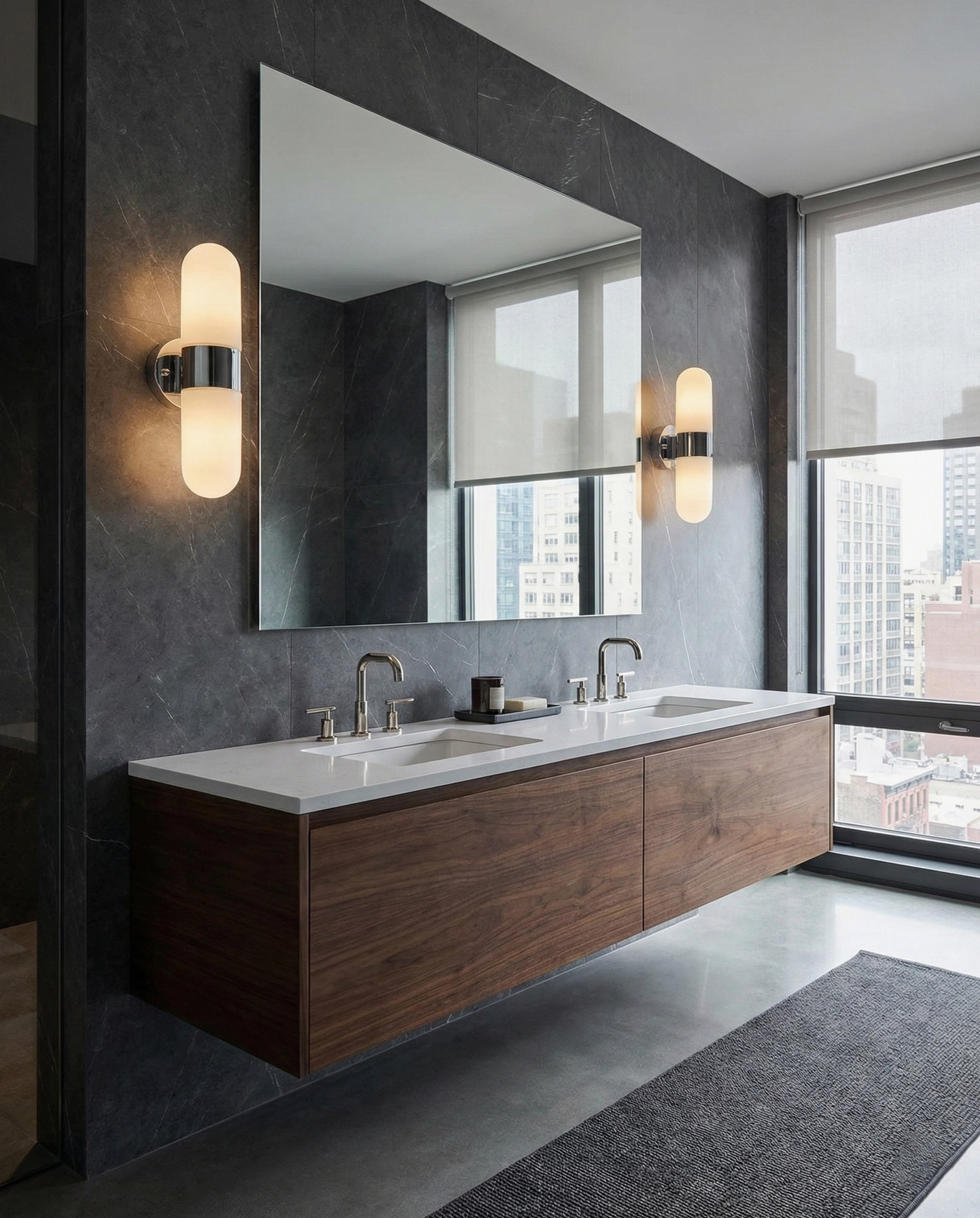 Modern wall sconce lighting in urban apartment bathroom with dark walls and city skyline view