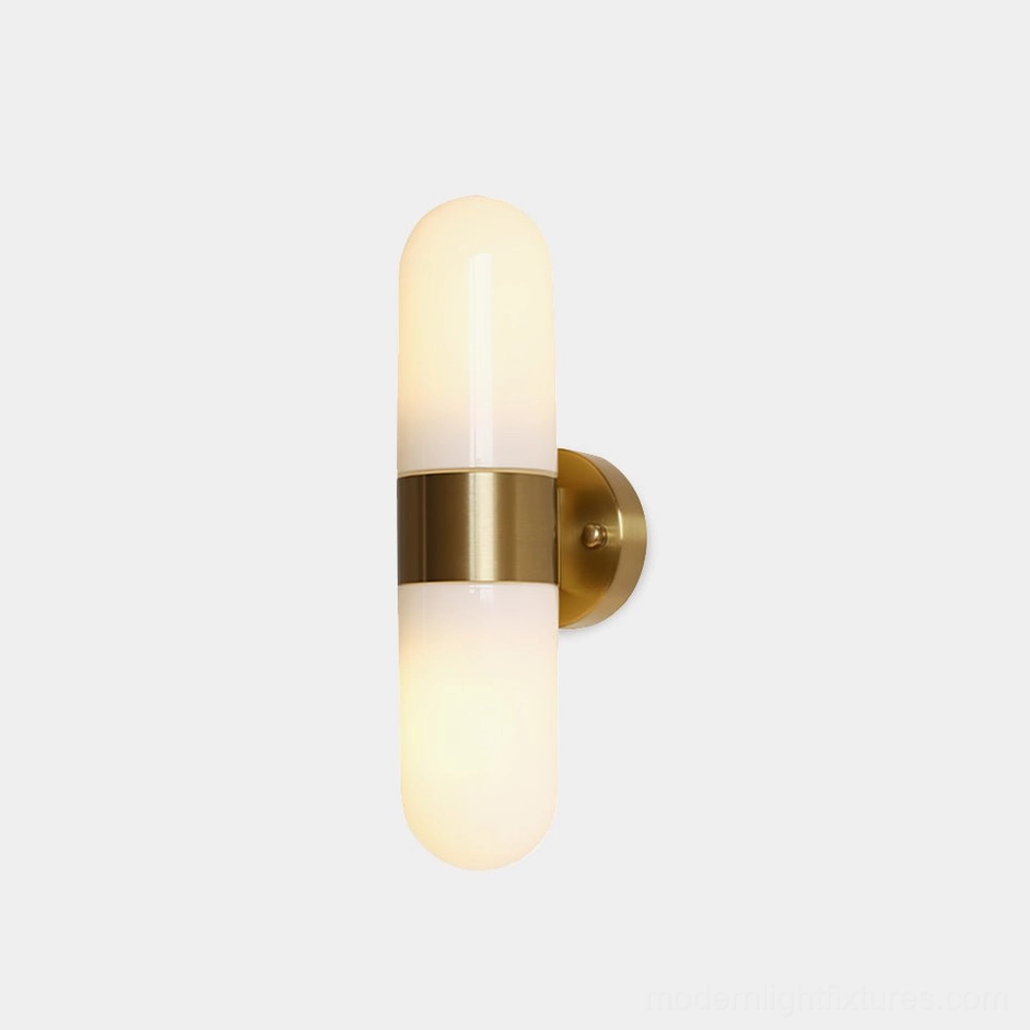 Milano modern wall sconce with frosted glass shade and brass metal accents - front close-up view