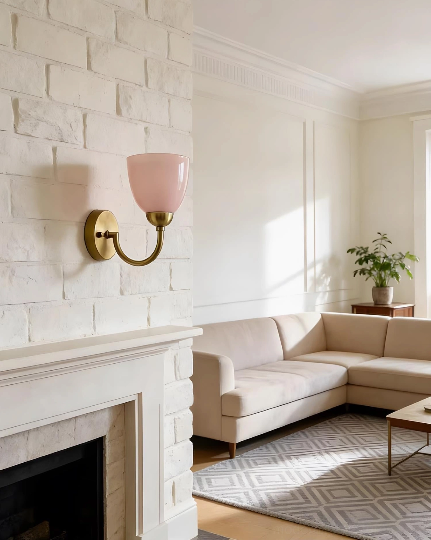 Mild Velin pink frosted glass wall sconce above white stone fireplace in family living room