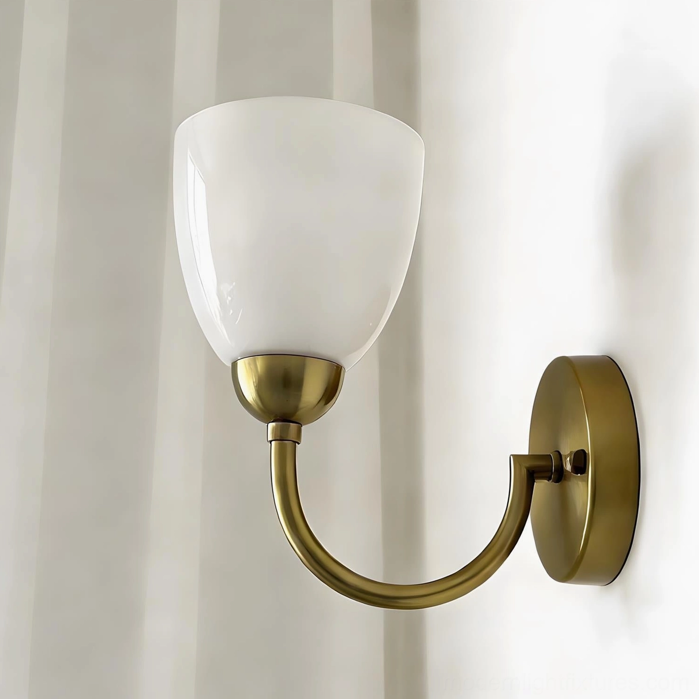 Mild Velin wall sconce gold and white variant - frosted glass shade with curved brass arm