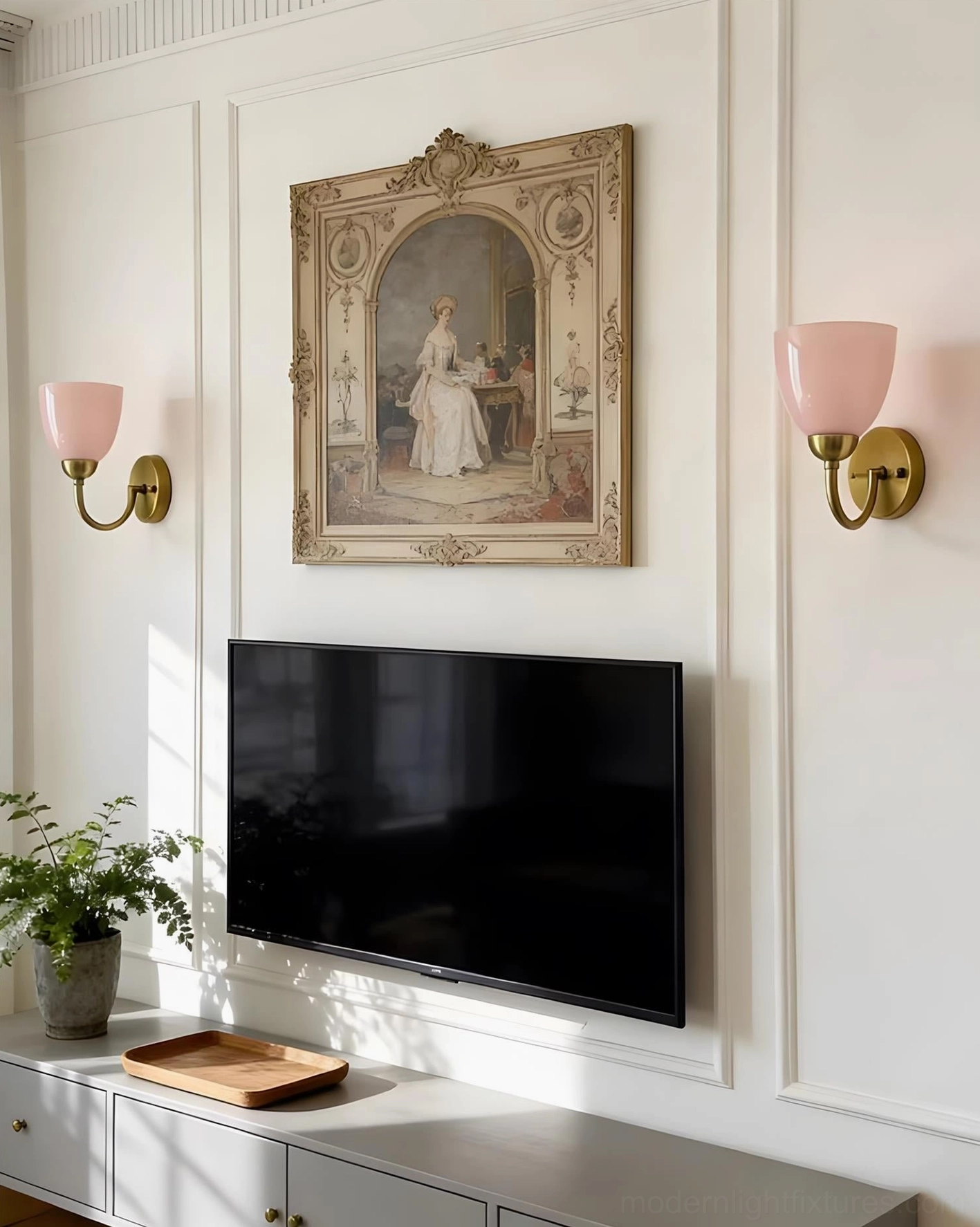 Pair of Mild Velin pink and brass wall sconces flanking TV wall in American traditional living room