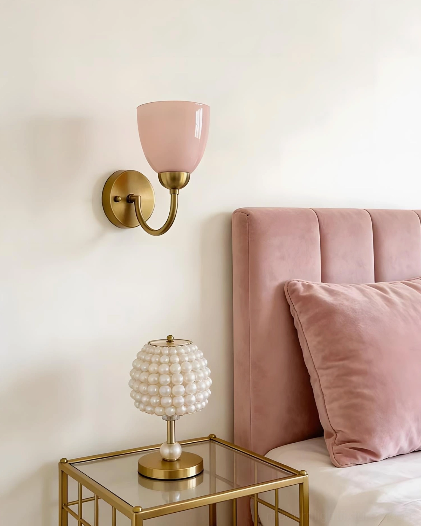 Mild Velin pink brass wall sconce beside pearl decorative lamp in bedroom sleeping area