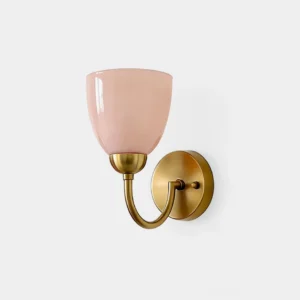 Mild Velin frosted glass wall sconce with brass arm in gold and pink - close-up studio view