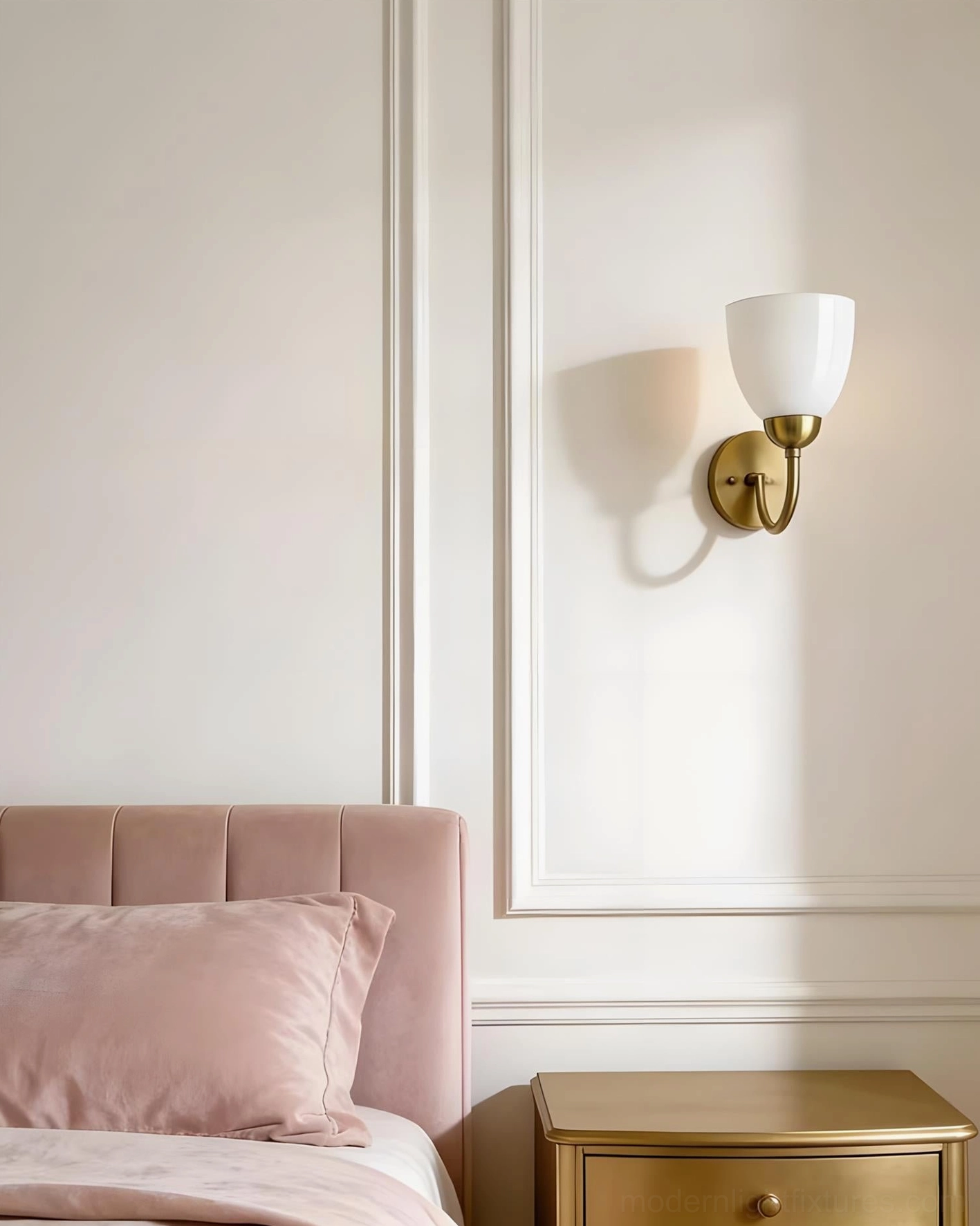 White Mild Velin wall sconce bedside lamp with brass hardware on tufted pink headboard