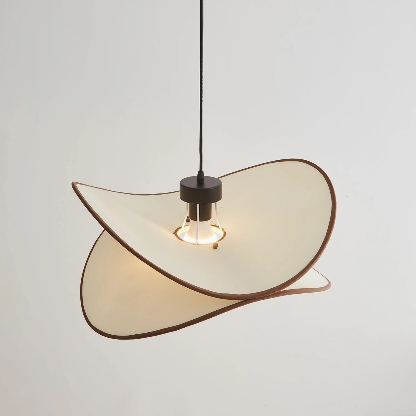 Miley fabric pendant light in dining application showing how warm glow complements table setting and interior furnishings