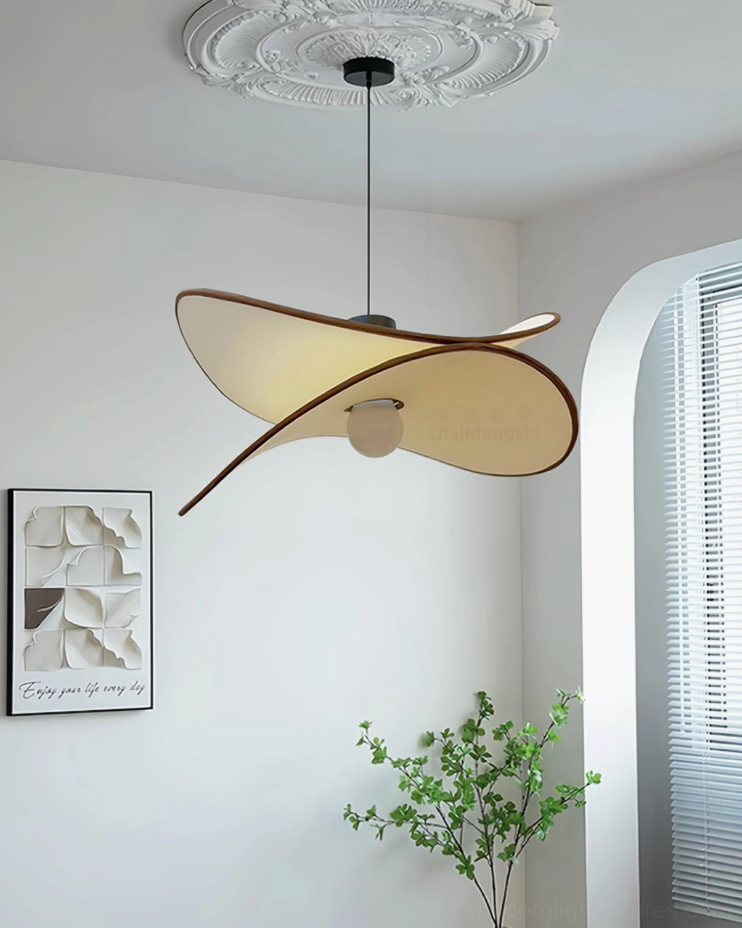 Miley cross-shaped fabric pendant light in three-quarter side view, suspended in minimalist living room with arched window and exposed lamp base detail