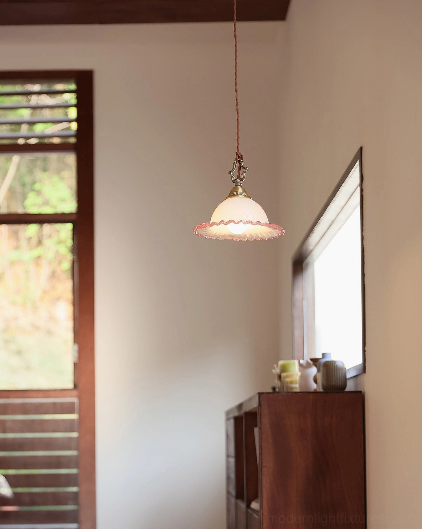 Delicate pink and milk glass pendant in narrow hallway - warm glow in transitional home interior